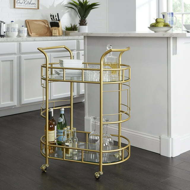 Fitzgerald Bar Cart with Matte Gold Metal Finish, 2-TiersDobaDealsexpress.shopFitzgerald Bar CartHighlights
2 Levels of glass shelf
3 Rings for bottle storage
Rolling and locking casters
Transitional or Modern style
A bar serving cart is ideal for home or office