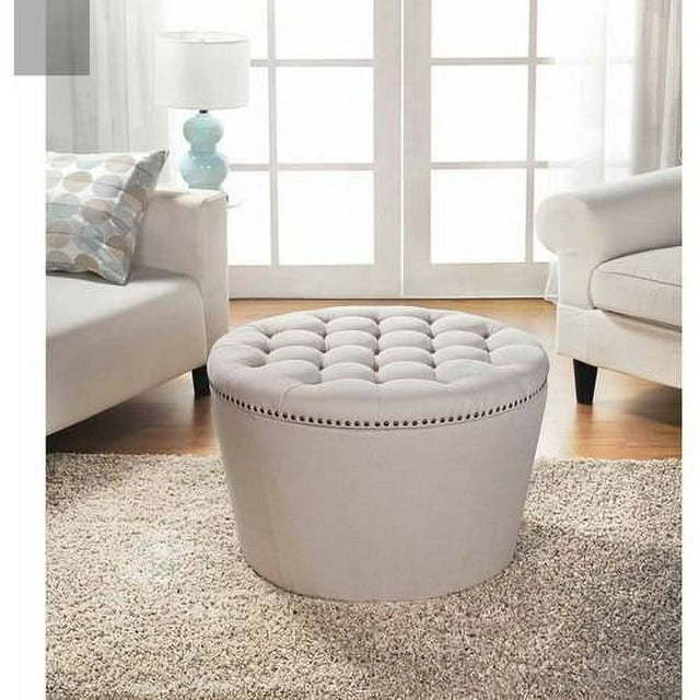 Round Tufted Storage Ottoman with NailheadsDobaDealsexpress.shopRound Tufted Storage OttomanHighlights
Features a tapered base, a chic tufted top in linen upholstery and nail head detailing
Top is generously padded for comfortable seating
Top is easily remo
