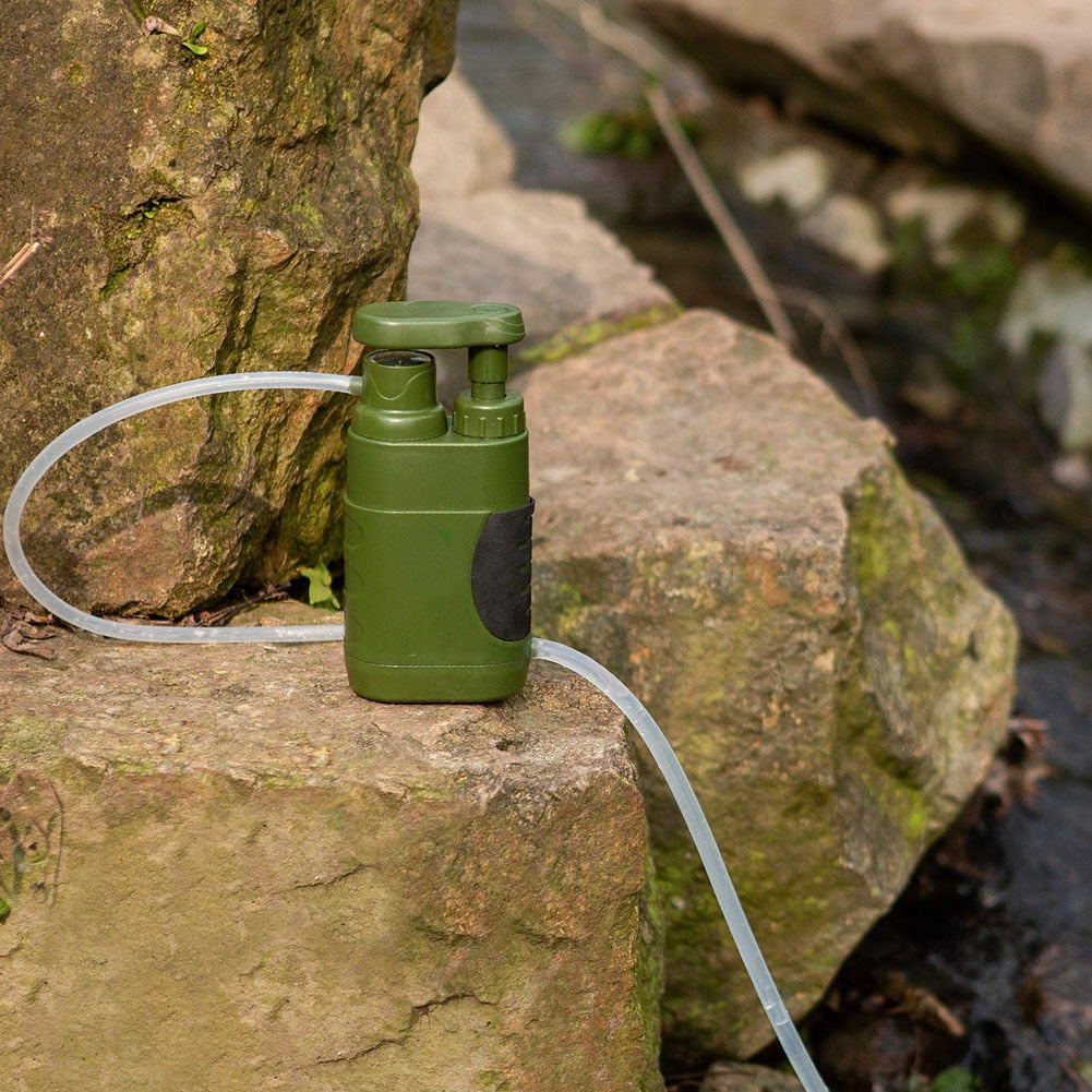 Portable Water PurifierDealsexpress.shopDealsexpress.shopPortable Water PurifierFeatures:1. Four levels of physical filtration for safe outdoor drinking2. Selected ABS material, durable, high-temperature resistance, more practical, and not easy 